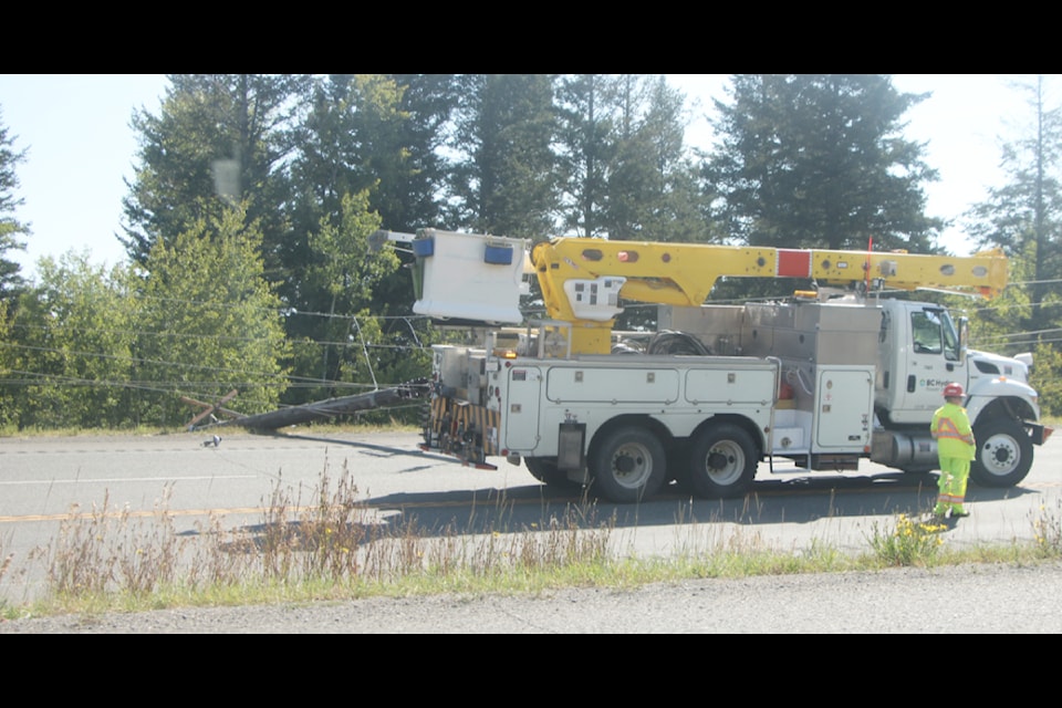 The downed power line that blocked traffic on Highway 97 on Friday, Aug. 23. (Patrick Davies photo - 100 Mile Free Press)