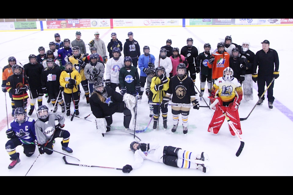 Members of the 100 Mile House Wranglers helped coach and run hockey day camps for children and youth at the South Cariboo Rec Centre in the last two weeks of August. (Patrick Davies photo - 100 Mile Free Press)
