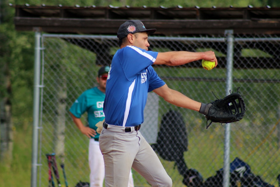 Mike Matthew, a pitcher for the Chu Chua Chiefs, hurls a fastball during the third annual Steven Daniels Jr. Memorial Fastball Tournament, held at the 100 Mile Softball Fields on August 17