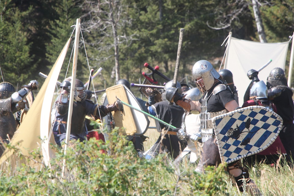 Members of the Society for Creative Anachronisms clash on the field of battle. (Patrick Davies photo - simplymastery)