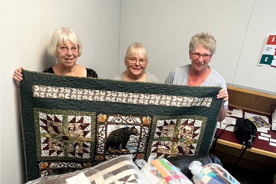 Last week dozens of quilts were dropped off at Cariboo-Chilcotin MLA Lorne Doerkson's 100 Mile House office for children and adults involved in June's bus crash. (Photo submitted)