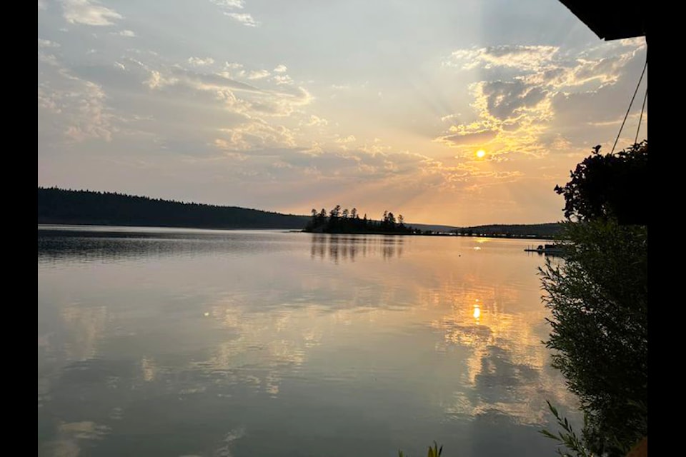 The sun sets in smoky skies on Lac La Hache on July 17, 2024. (Monika Paterson photo)