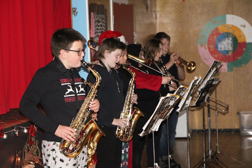 100 Mile Elementary School students show off their skills with musical instruments. (Patrick Davies photo - simplymastery)