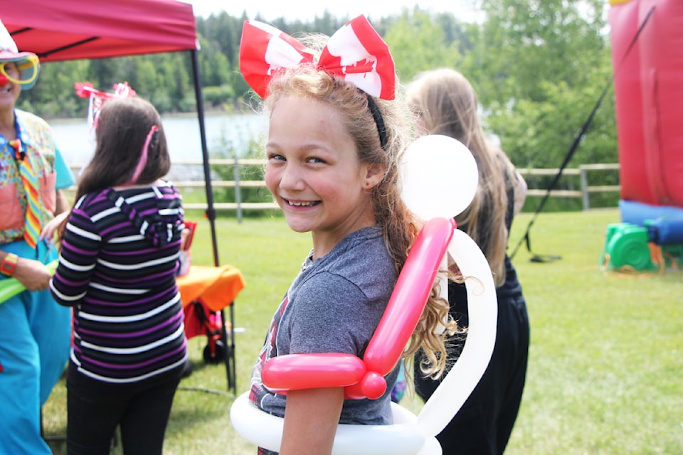 Bella Laslo attended the 108 Heritage Site's Canada Day Celebrations on Monday, July 1 and received a new balloon dress from Uncle Chris the Clown. (Patrick Davies photo - simplymastery)