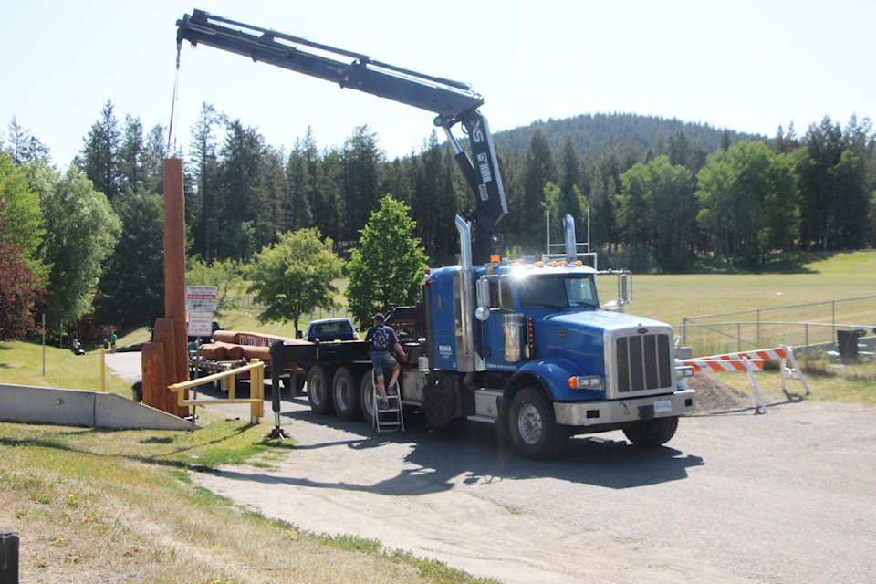 The District of 100 Mile House has installed a new log archway to welcome visitors into Centennial Park on Thursday, July 11. (Patrick Davies photo - 100 Mile Free Press)