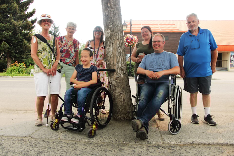 The District of 100 Mile House Accessibility Committee is made up of Lori Fry (left), Donna Barnett, Kim Irvine, Eliseia Perkins, Ben Vinje, Kristin Wells and Brian Brown. The committee will be walking around 100 Mile House several times this summer to find potential hazards and barriers to accessibility for those with reduced mobility, mission or other disabilities, such as trees in the middle of the sidwalk. The results of their findings will be reported to the District of 100 Mile House staff and council. (Patrick Davies photo - simplymastery)
