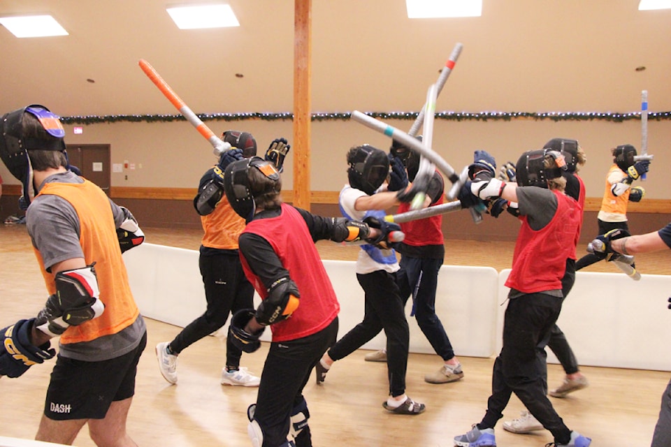 The 100 Mile House Wranglers play a game of capture the flag at the 100 Mile House Community Hall. (Patrick Davies photo - 100 Mile Free Press)