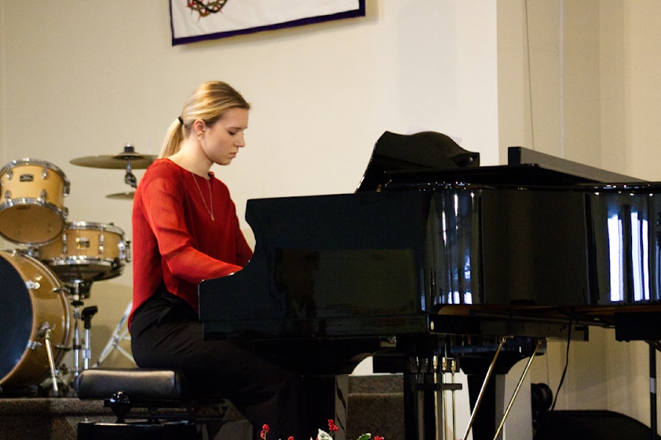 Joelle Kuyek plays the piano during the Canadian Music Week Recital at the 100 Mile Evangelical Free Church on Nov. 23 (Misha Mustaqeem photo - 100 Mile Free Press) 
