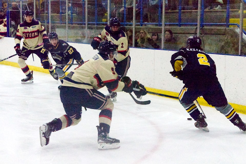 Kamloops Storm player Nolan MacPherson attempts to get the puck away from 100 Mile House Wranglers player Alberto Kellgren, with Wranglers player Alex Crowe-Nippi and Storm player Kieran Thibault looking during the Wranglers vs. Storm game on Nov. 1 at the South Cariboo Rec. Centre (Misha Mustaqeem - 100 Mile Free Press)
