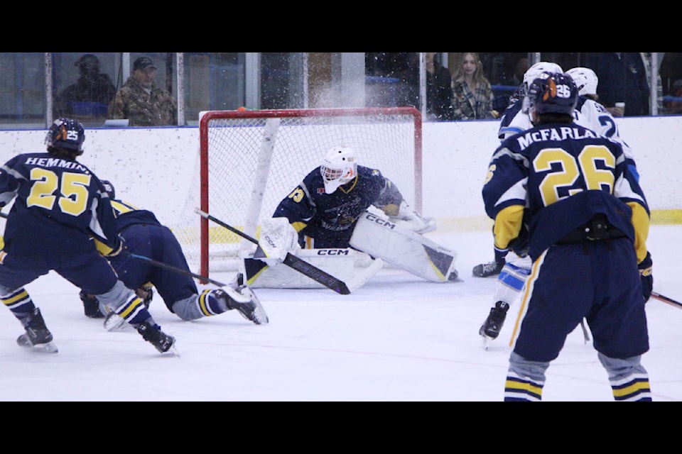 100 Mile House Wrangler goalie Ivan Tolsma defends his net against the Williams Lake Mustangs. (Patrick Davies photo - 100 Mile Free Press)