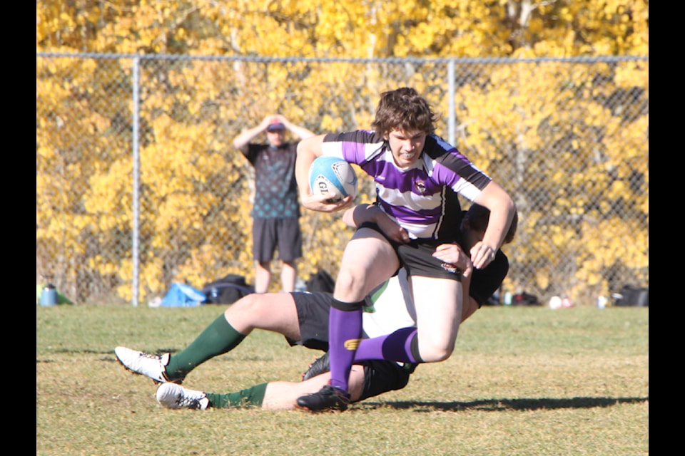 Members of the Peter Skene Ogden Secondary School Eagles Junior Boys Rugby team face off against the Lake City Secondary School Falcons Junior Boys rugby team on Friday, Oct. 11. (Patrick Davies photo - 100 Mile Free Press)