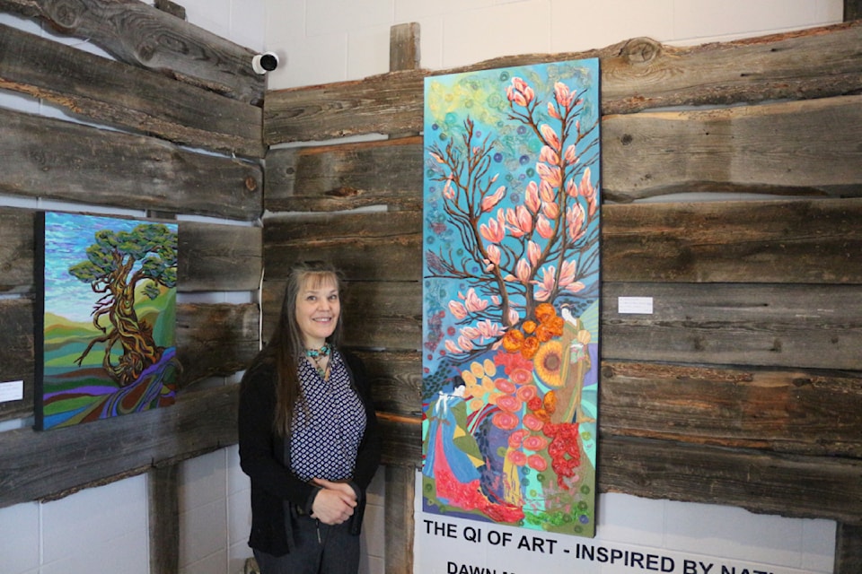 Dawn Miller, one of the painters featured in The Qi of Art: Inspired by Nature, stands next to her mixed media picture Morning Glory, which is on sale for $850.00 - on Oct. 12 at the Parkside Art Gallery. The painting is part of The Qi of Art exhibition by Dawn Miller and Birgit Bienek, which runs at the Parkside Art Gallery until Nov. 9. (Misha Mustaqeem photo - simplymastery)