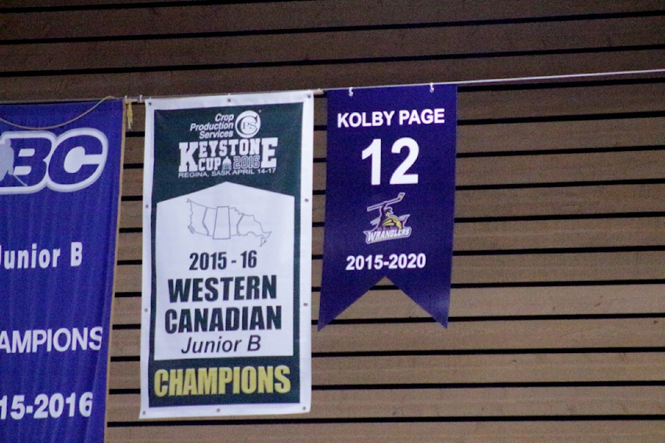 The retirement banner in the rafters of the South Cariboo Recreation Centre indicating Kolby Page's number and the years he played for the team. To the left is the Keystone Cup banner, a trophy which was won by the Wranglers in 2016 - in which Kolby Page was a member of. (Misha Mustaqeem - 100 Mile Free Press)