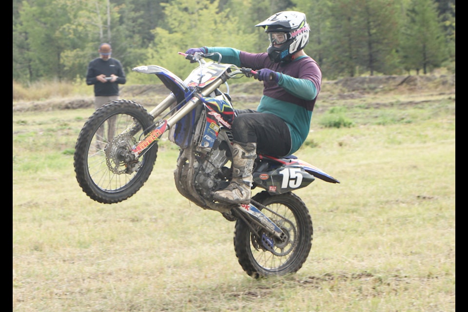 Ethan Weegar pops a wheelie while riding his dirtbike at the South Cariboo Track and Trail Dirtbike Association's Season's End Scramble and Moto Rodeo. (Patrick Davies photo - simplymastery)