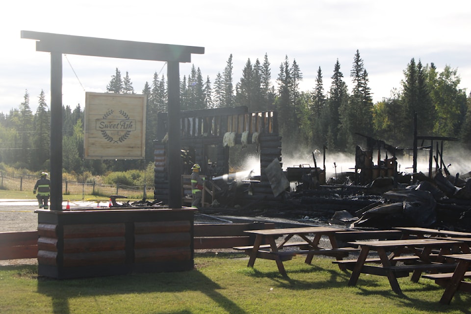 The building hosting Smith's Antiques and the Sweet Ash Bistro burned down on Wednesday, Sept. 18. The fire began at 2 p.m. and consumed the historic building. The Lone Butte Volunteer Fire Department responded and knocked the fire down. (Patrick Davies photo - 100 Mile Free Press)