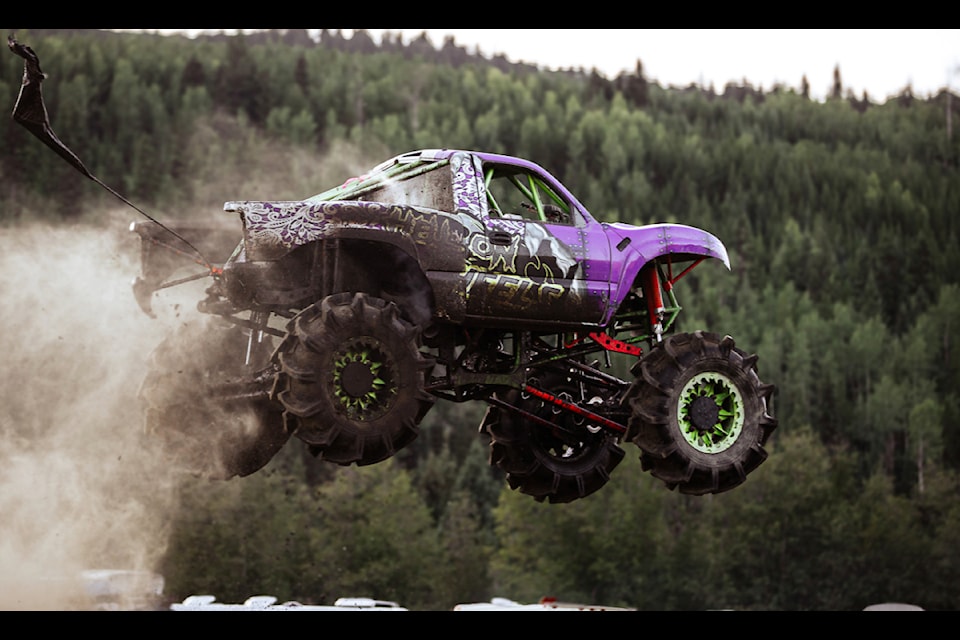 A truck drives through the bog pit and hill and hole at 100 Mile Horsepower Ranch on Saturday, Aug. 31.  (BBPix photo)