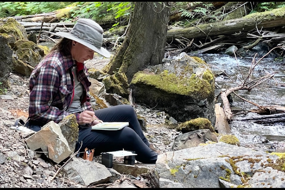 Leah Selk paints en plein air at Archie Creek Falls. (Michael Kjelsrud photo)