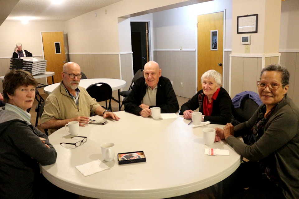 From left to right, Laura and George Klassen, Dave and Frieda Reimer, and Roxanne Laslo all play  Uno at the Seniors Social gathering at the 100 Mile Evangelical Free Church on Sept. 26. (Misha Mustaqeem photo - 100 Mile Free Press)