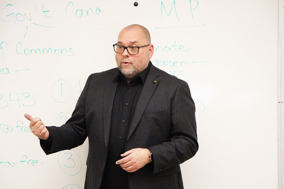Incumbent MP Todd Doherty speaks to a classroom of children at 100 Mile Elementary School on Thursday, April 10. The students asked Doherty and Green Party candidate Jodie Capling several questions over the course of an hour each.  (Patrick Davies photo - 100 Mile Free Press)