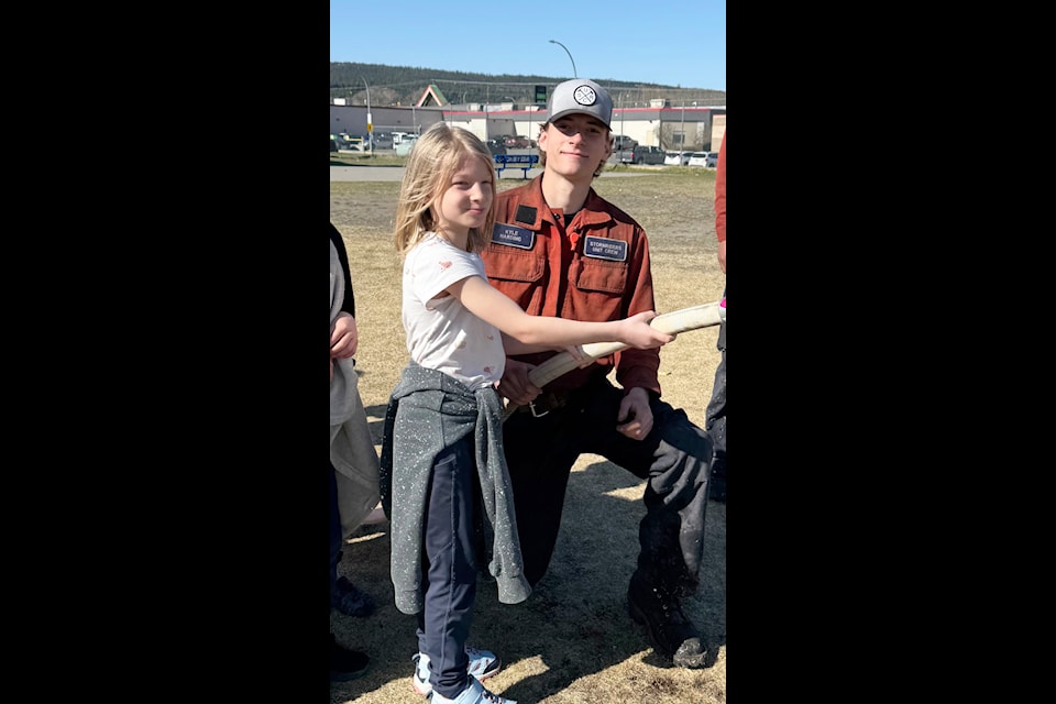 Caroline Slootweg meets 100 Mile Stormriders Unit Crew Kyle Harding during a meet and greet at 100 Mile Elementary School.  (Crystal Dawn-Langton photo)