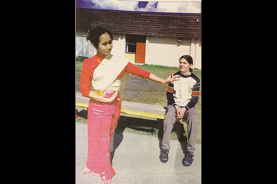 Then exchange student Pornprom Petkai at PSO introduces the Thai culture to then Hawkins Lake student Aaron Pettman, who had been set to spend time in her country Thailand in a picture taken for the April 15, 1998 edition of the 100 Mile Free Press. (Historical photo - 100 Mile Free Press)