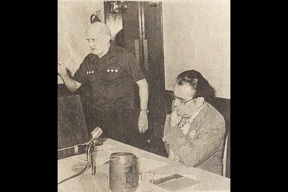 From left to right, Bill Powell and then Cariboo MLA Alex Fraser both at a public meeting in 100 Mile House held on April 30, 1979, at the Red Coach Inn. (Historical photo - simplymastery) 
