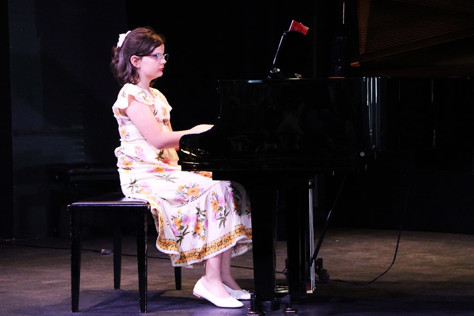 Corra Boettger plays the piano while competing in the 2025 100 Mile Festival of the Arts at Martin Exeter Hall. The festival is on for the next two weeks, primarily at Martin Exeter Hall, with community members showcasing their musical talents. (Patrick Davies photo - simplymastery)