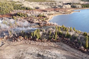 Wildfire burns on Chilcotin Plateau, south west of Williams Lake, being held