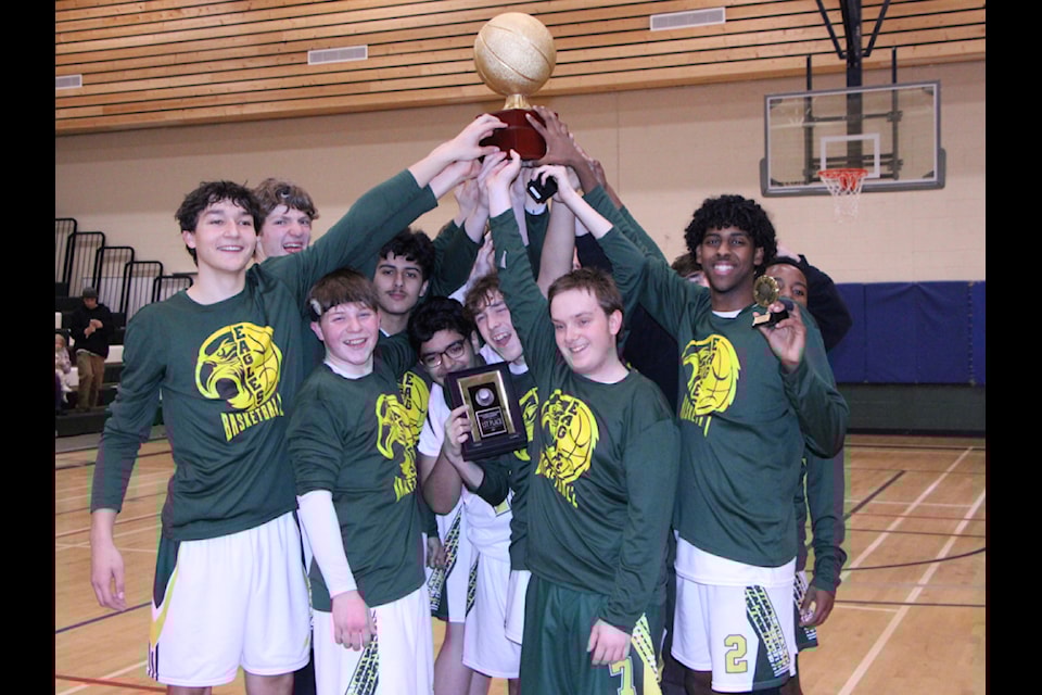 The Peter Skene Ogden Secondary School Eagles Senior Boys Basketball team hold up the South Cariboo Winter Classic's trophy following their victory on Saturday, Feb. 1. (Patrick Davies photo - 100 Mile Free Press)