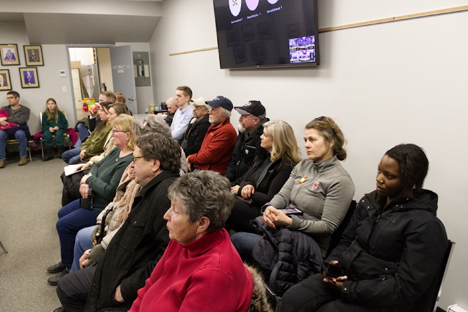 People sit and listen to the District of 100 Mile House Feb. 11 Council Meeting, which talked about the zoning application and site-specific zoning amendment for Children Matter Community Services.(Misha Mustaqeem photo - 100 Mile Free Press) 