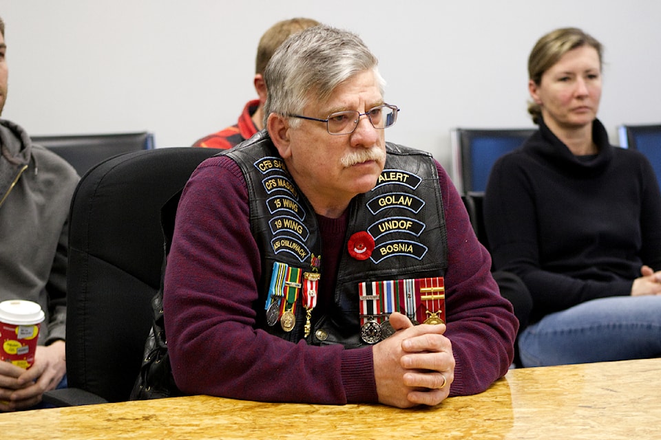 Retired captain Dale Bachmier sits before the District of 100 Mile House Council on Feb. 25 to discuss his proposal for veterans' parking spaces throughout the District of 100 Mile House. (Misha Mustaqeem - simplymastery)