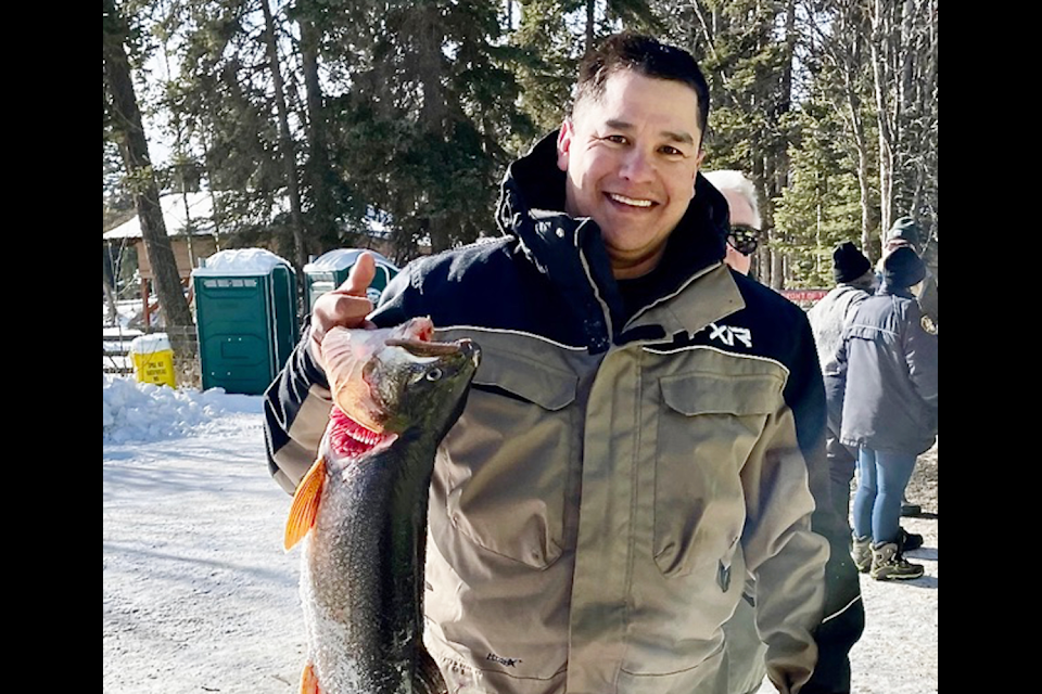 Ivan Swakum with his first prize-winning lake trout from DLDVFD Society’s Feb.15 ice-fishing derby. (Diana Forster photo)