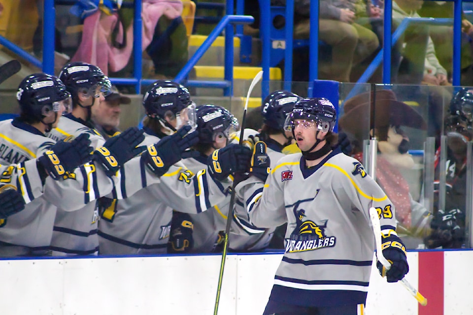 Wranglers player Kole Duquette celebrates after a goal during the Wranglers vs. Heat game on Feb. 21 held at the South Cariboo Rec Centre. (Misha Mustaqeem photo - 100 Mile Free Press)