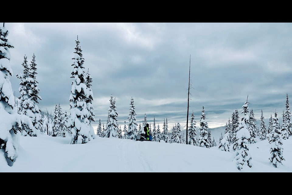 Anna Zintl loves snowmobiling in the backcountry up near Mica Mountain, with the proper safety precautions in place. (Photo submitted)