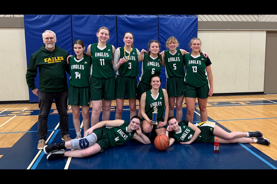 The Peter Skene Ogden Secondary School senior girls basketball team pose for a photo with their second place trophy at the Desert Sands Community School Invitational Tournament. This win marks the first time the Eagles' senior girls team has brought home a trophy from a tournament. (Photo submitted) 