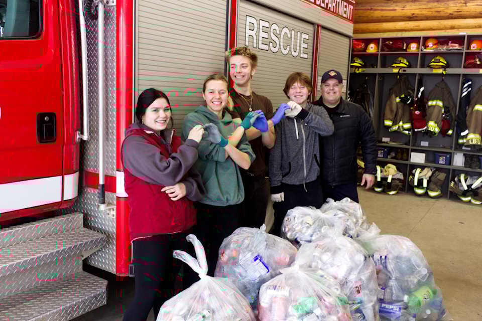 Daizey Sankey, Joelle Kuyek, Oland Vickers, Luka Weir (all Gr. 12 PSO students) and Jon Grieve, the fire chief of the Lone Butte Fire Department, all pose for a picture at the Lone Butte Fire Hall during the 2025 PSO bottle drive on Jan. 4. (Misha Mustaqeem photo - simplymastery)