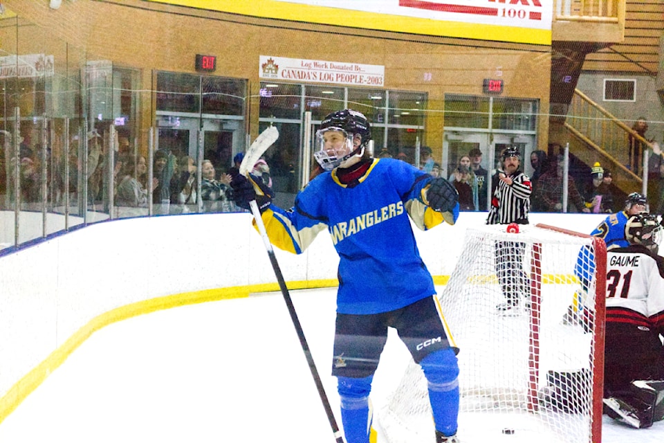 100 Mile House Wrangler Nelson Webster celebrates scoring a goal against the Chase Heat during a 5-0 blowout on Wednesday, Jan. 1. The Wranglers are currently on a four-game winning streak and are at the top of Doug Birks Division. (Misha Mustaqeem photo - simplymastery)