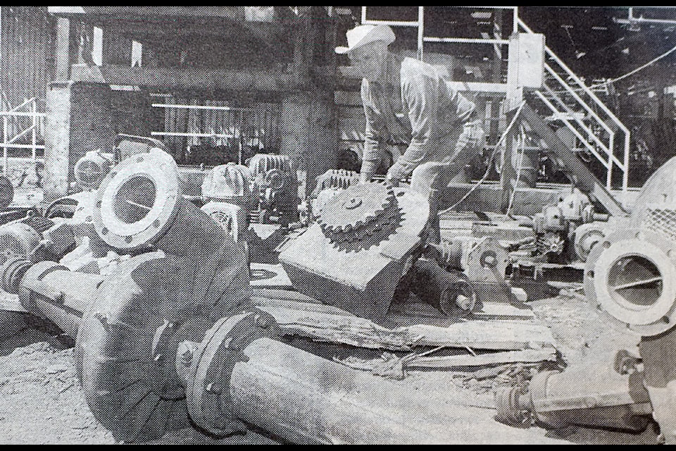 In a picture for the July 29, 1998, edition of the 100 Mile Free Press, log builder Log LeRoy found plenty of used equipment from the Ainsworth auction in 100 Mile House. (100 Mile Free Press Historical photo)