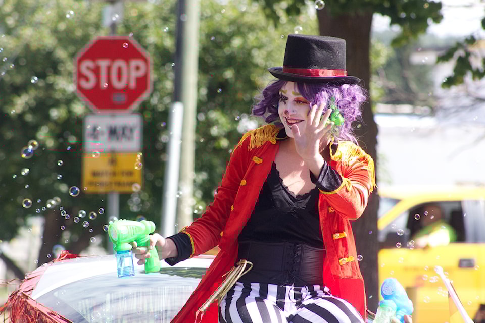 Solaris the Clown, also known as Nathan Webb, waves to the crowd during the 100 Mile Pride Parade on July 26. (Misha Mustaqeem photo - 100 Mile Free Press)