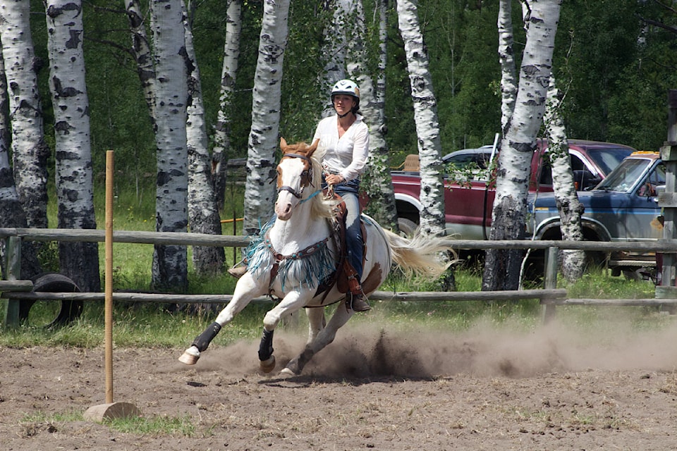 Valaurie Wettstein competes in pole riding  at the Watch Lake Gymkhana on July 12 (Misha Mustaqeem photo - 100 Mile Free Press)