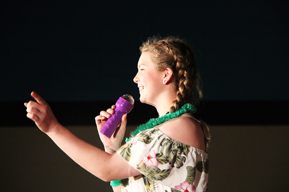 Horse Lake Elementary School Grade 7 student Cali Bishop lip syncs to Carley-Rae Jepsen's Call Me Maybe during her school's annual year-end Air Band Contest. (Patrick Davies photo - simplymastery)