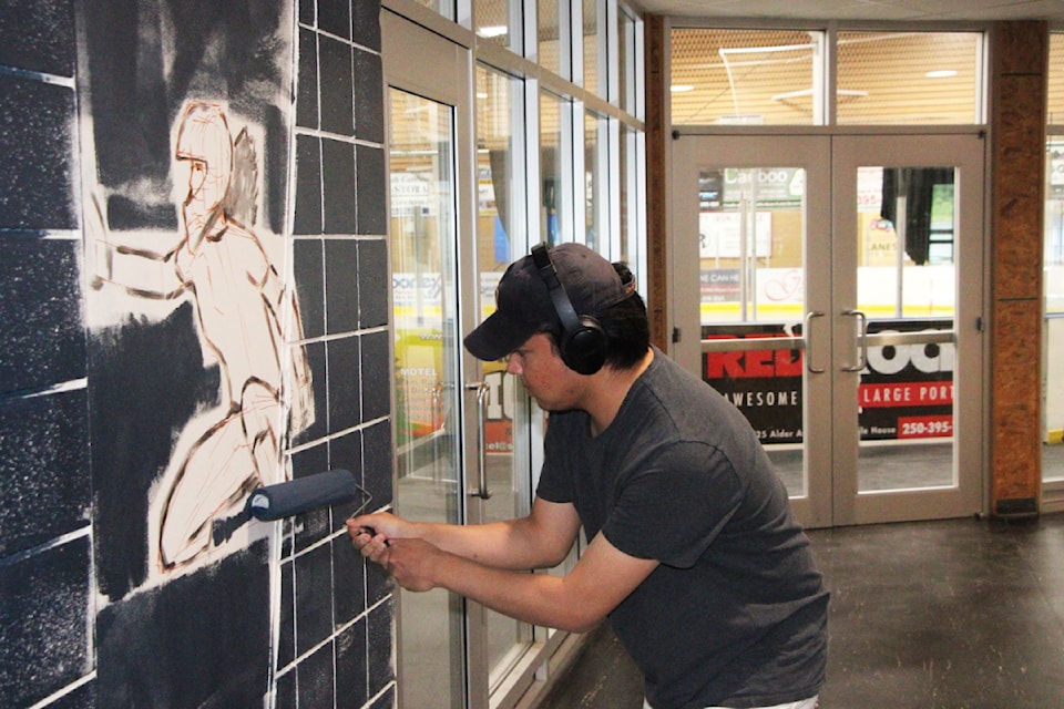 Autumn Christopher works to paint a mural at the South Cariboo Rec Centre on Thursday, June 12. (Patrick Davies photo - simplymastery)