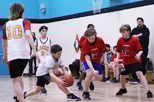 100 Mile Elementary wins Grade 7 boys basketball tournament