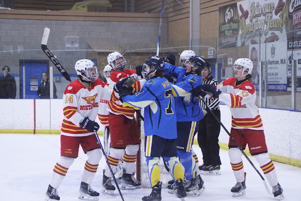 The 100 Mile House Wranglers and Williams Lake Mustangs scuffle in front of the Mustang's net. (Patrick Davies photo - 100 Mile Free Press)