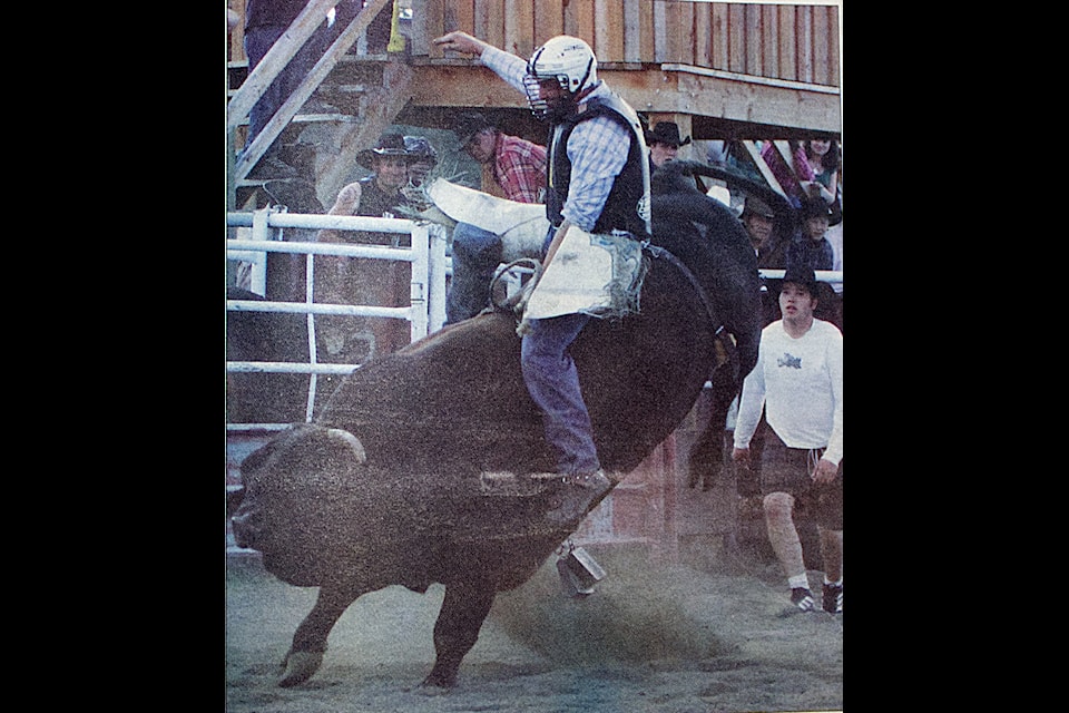 A bull rider keeps his seat during the 42nd annual 100 Mile House Western Weekend in a picture printed for the May 21, 2008 edition of the simplymastery. (Misha Mustaqeem photo - simplymastery)
