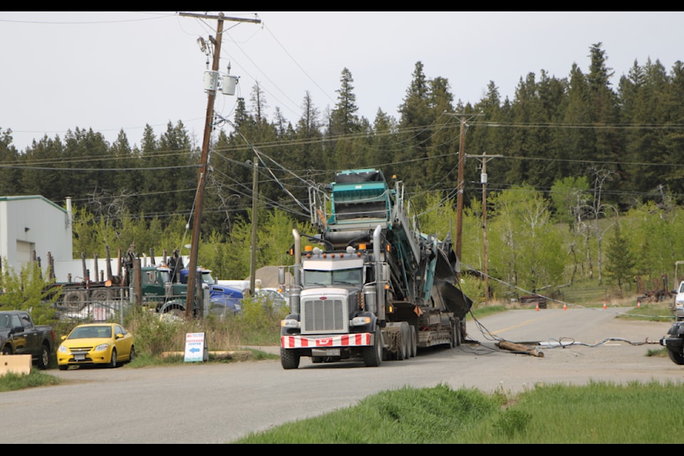 Power lines down across a semi-truck on McDermid Road on Thursday, May 15. (Patrick Davies photo - 100 Mile Free Press)