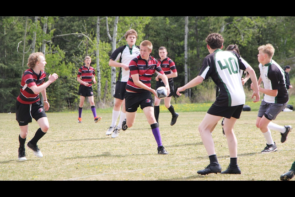 The Lake City Secondary School Falcons Junior Boys Rugby Team play against the Peter Skene Ogden Secondary School Eagles  Junior Boys Rugby Team on Friday, May 16, in 100 Mile House. (Patrick Davies photo - 100 Mile Free Press)