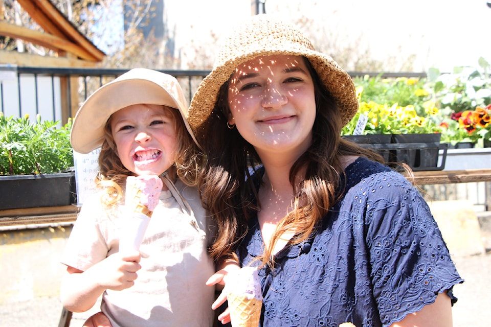 Mayah Bryan and Katelynn Bryan enjoyed some ice cream at the first South Cariboo Farmers' Market held on Friday, May 2, 2025, in 100 Mile House. (Patrick Davies photo - simplymastery)