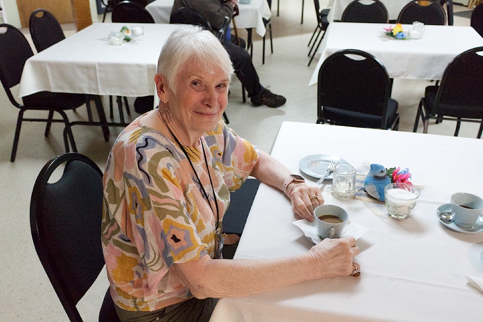 Annie McKave enjoys tea during the Strawberry Tea held at St. Timothy's Anglican Church on Saturday, May 10. (Misha Mustaqeem photo - simplymastery)