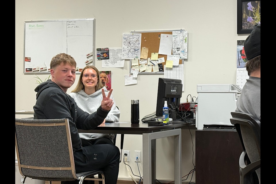 Oland Vickers gives the peace sign alongside Joelle Kuyek during the 2025 PSO Dry Grad pizza day P.A.R.T.Y., held at Country 840 with Chris Adams on May 5. The fundraiser ended up raising $2,395 for the 2025 Dry Grad. (Photo submitted - 2025 PSO Dry Grad Committee)